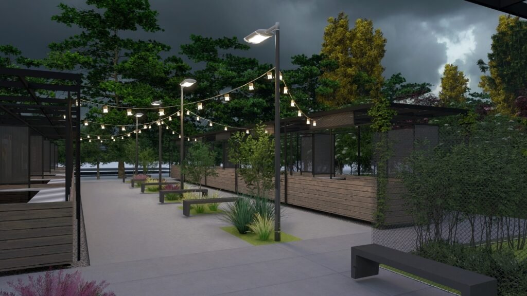Proyección nocturna de los puestos comerciales exteriores del Paseo Ferroviario.