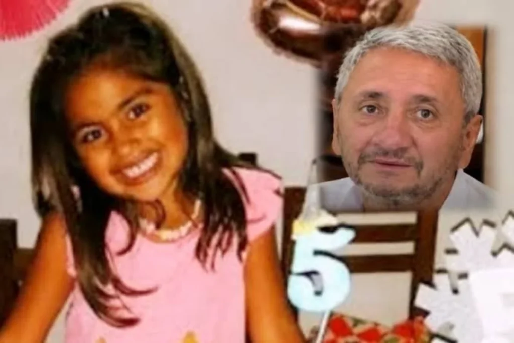 Imagen de archivo de Roque Lucero junto a una niña.